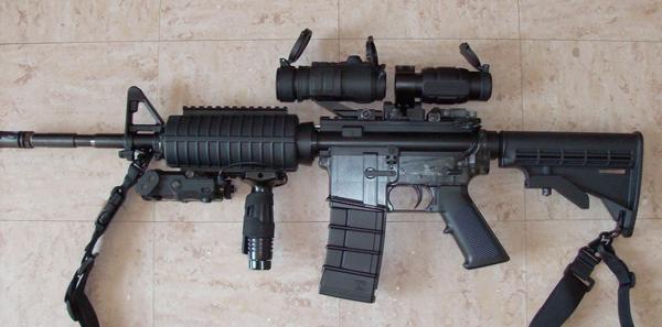 KJW M4A1 w/accessories (1x Red Dot w/3x magnifier, flip up rear sight, laser/light and foregrip)