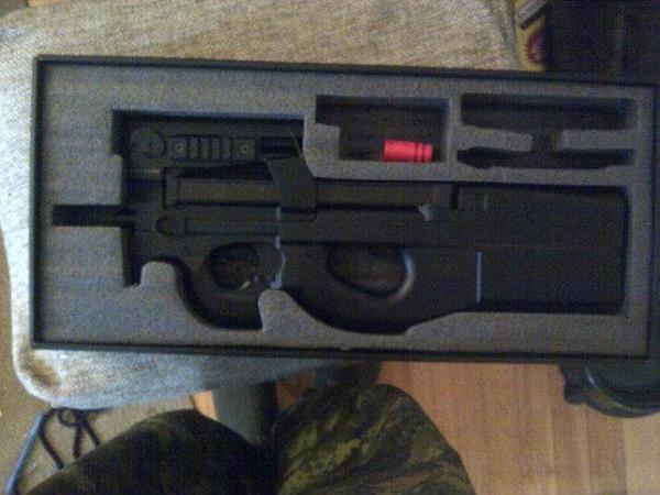 king arms p90 freshish out of the box (first thing I did was make sure it worked, then took the ungodly orange tip off)